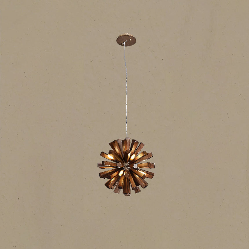 The fitting lit on its single cable against a warm plain ground