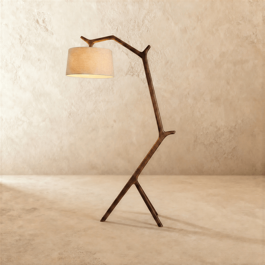 The same branch shaped frame in dark wood, the cream drum shade held out in front