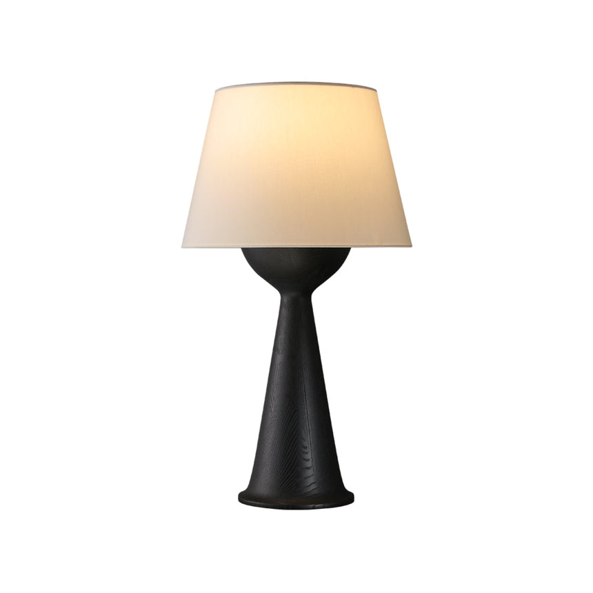 Natural wood Japandi table lamp lit and seen from the front, plain ground