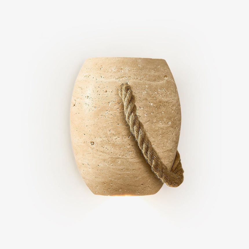 Japandi wall lamp shaped like a small travertine urn with a thick hemp rope looped across it