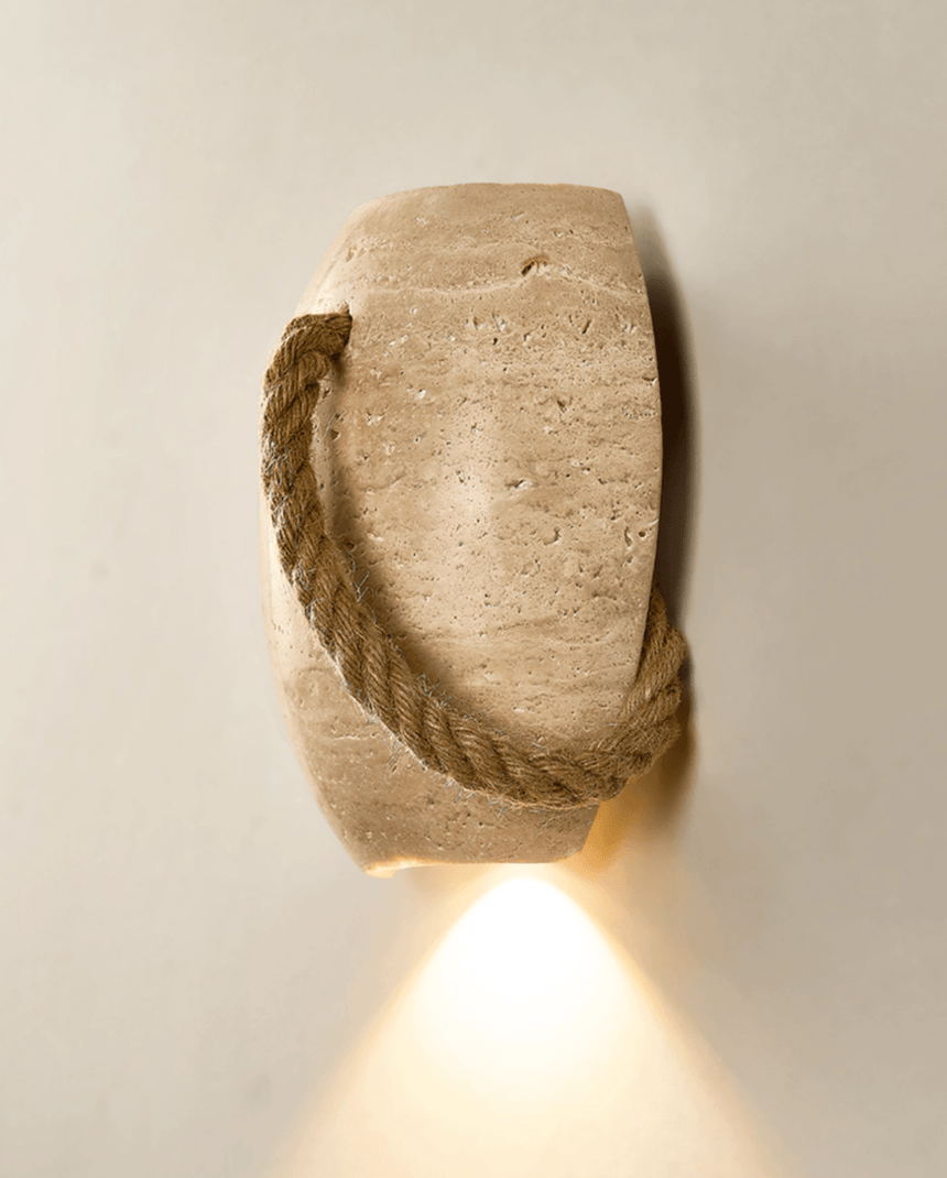 The urn with the rope running down its left side, the downlight glowing below