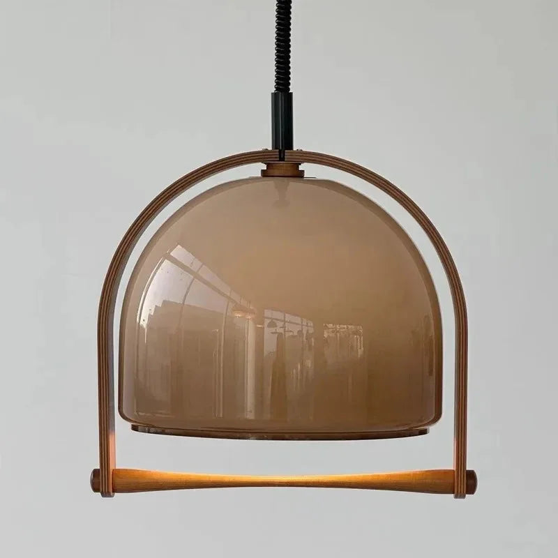 The smoke tinted dome in its wooden arch seen against a pale wall