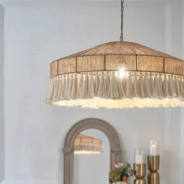 Close view of the jute fringe hanging from the rim of the drum shade
