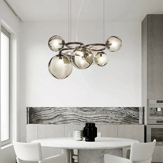Glass orb chandelier illuminated in living room