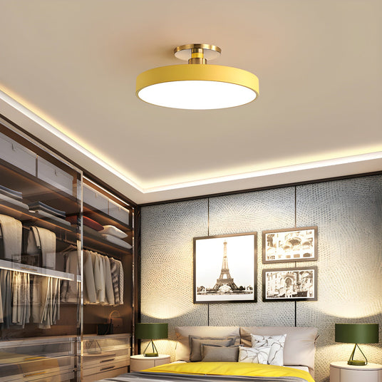 Yellow drum ceiling light in a dressing room with open wardrobes