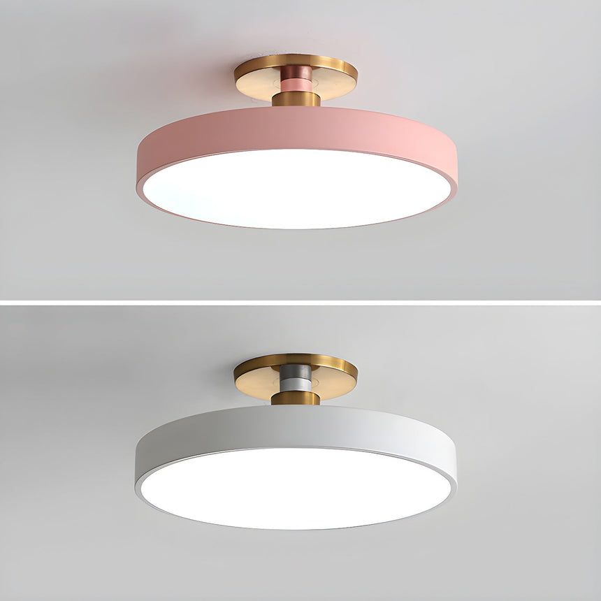 Pink and white drum ceiling lights shown on a plain backdrop