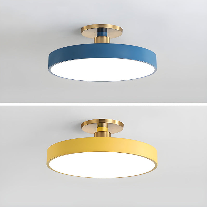 Blue and yellow drum ceiling lights shown on a plain backdrop