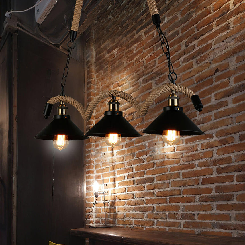 The cones lit in front of a brick wall above a narrow bar counter