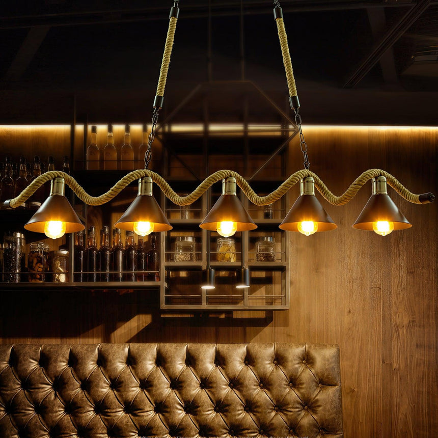 Chandelier lit above a leather booth against a wood panel wall