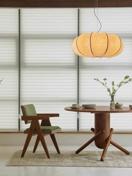 Ribbed silk lantern above a round dining table