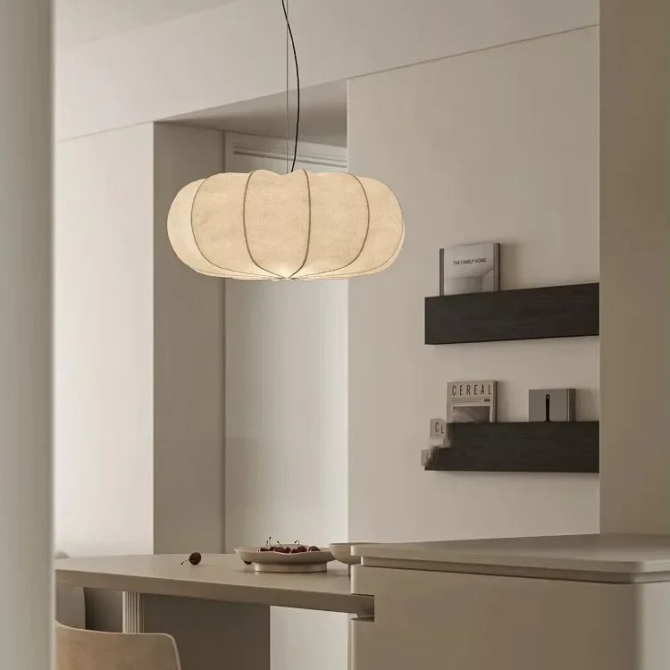 Ribbed silk lantern in a room with dark shelves