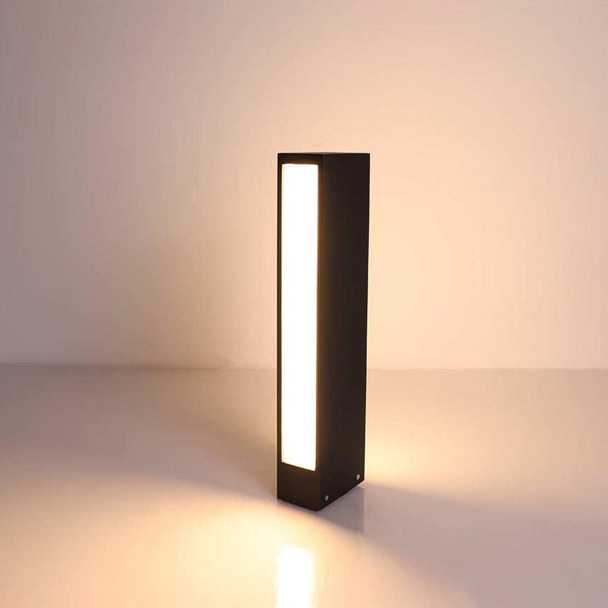 The lit slot glowing down the face of the body on a pale ground