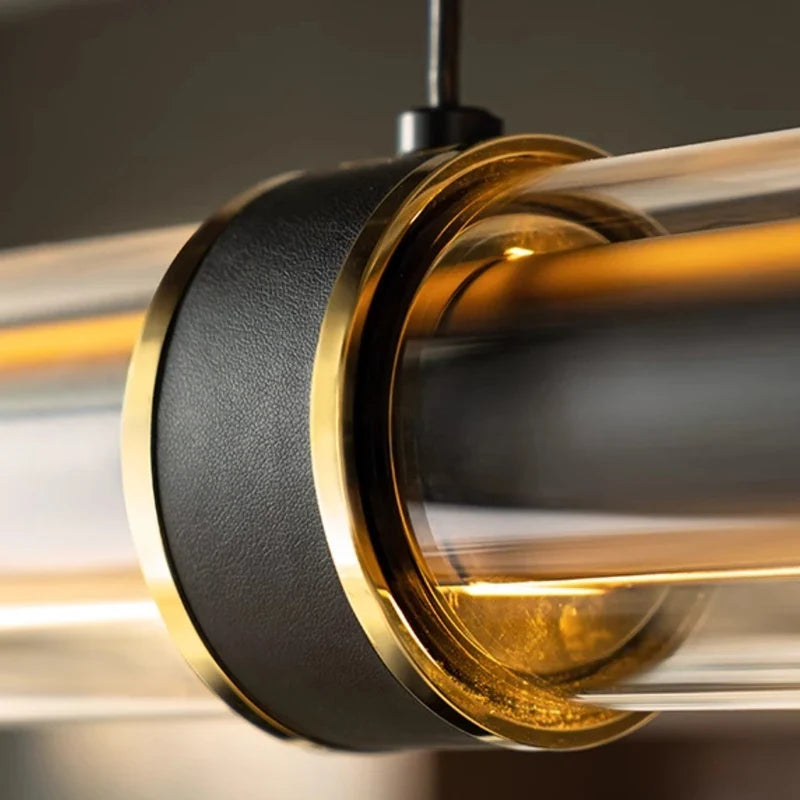 Close view of the metal collar holding the lit tube inside the glass