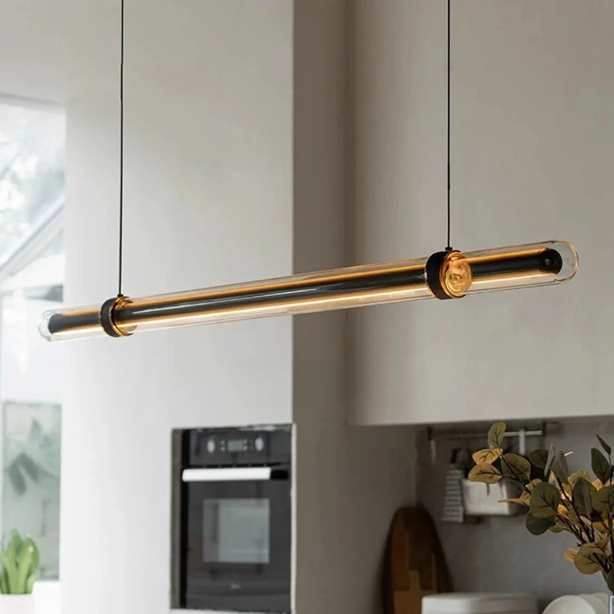 The lit glass bar hung across a wide kitchen above the worktop