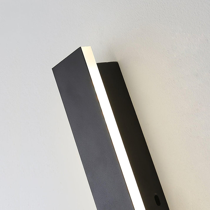 The strip seen at an angle against a pale surface, the acrylic edge lit warm