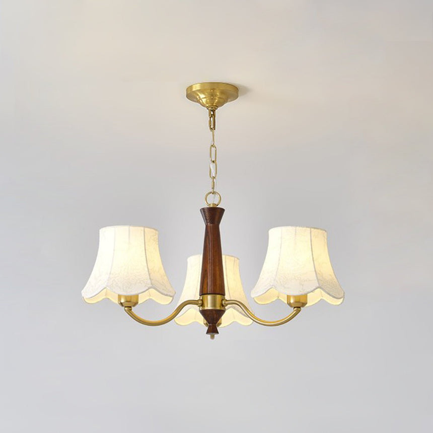 The three light build, brass arms and three fabric bell shades