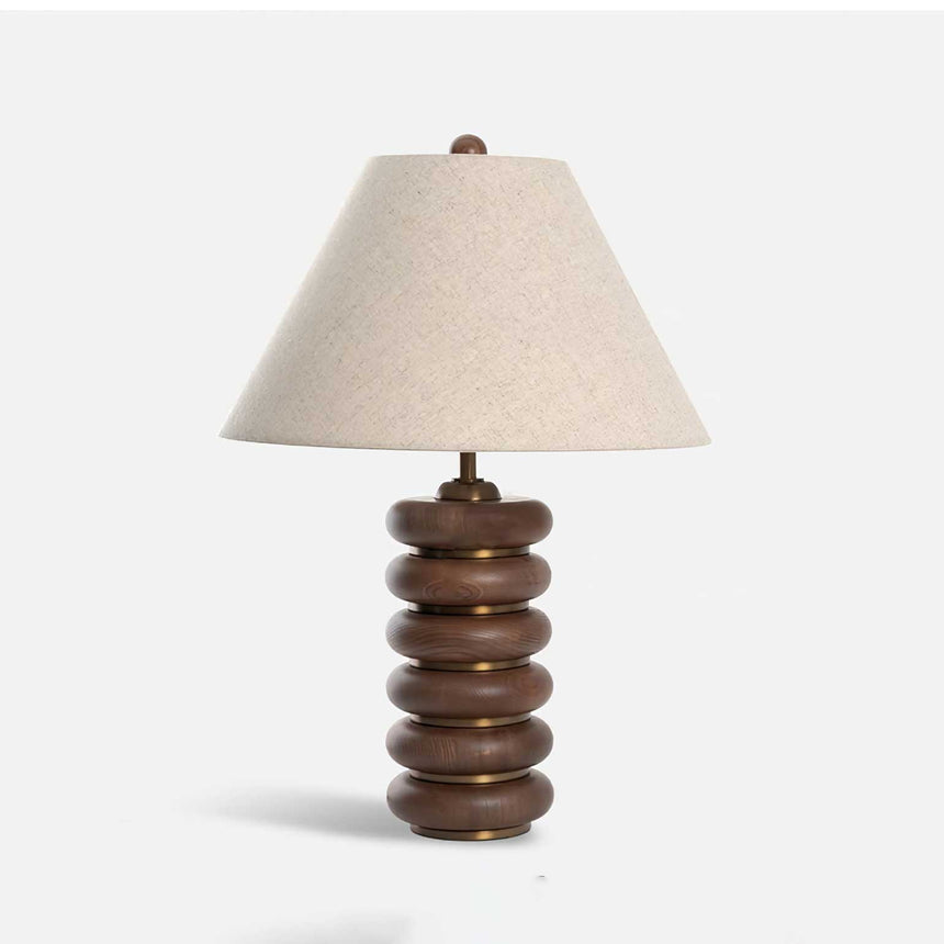 Linen shade table lamp unlit and seen at a slight angle