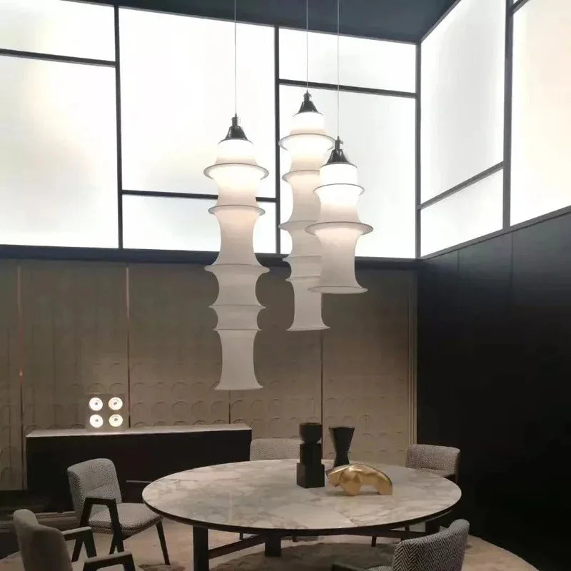 Three stacked silk columns hung over a round dining table