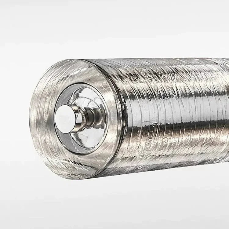 Close view of the chrome end cap closing the ribbed glass tube