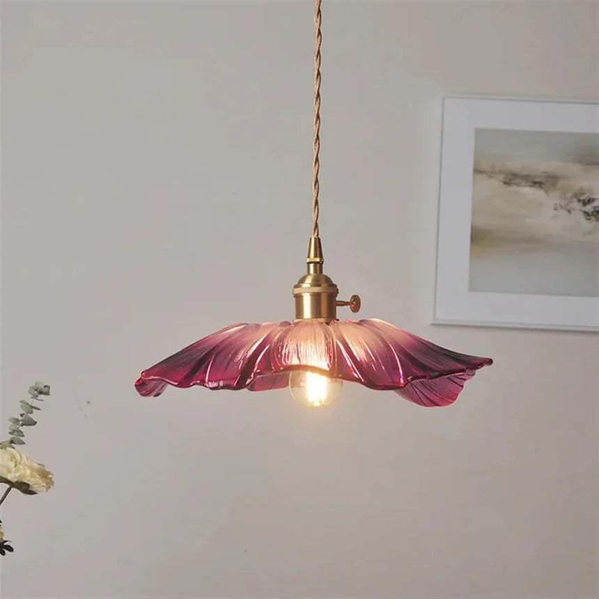 The purple lotus shade seen alone against a plain pale background