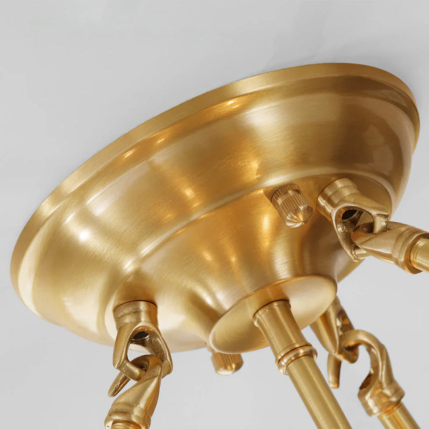 Close view of the brass ceiling plate and the arms that carry the drum