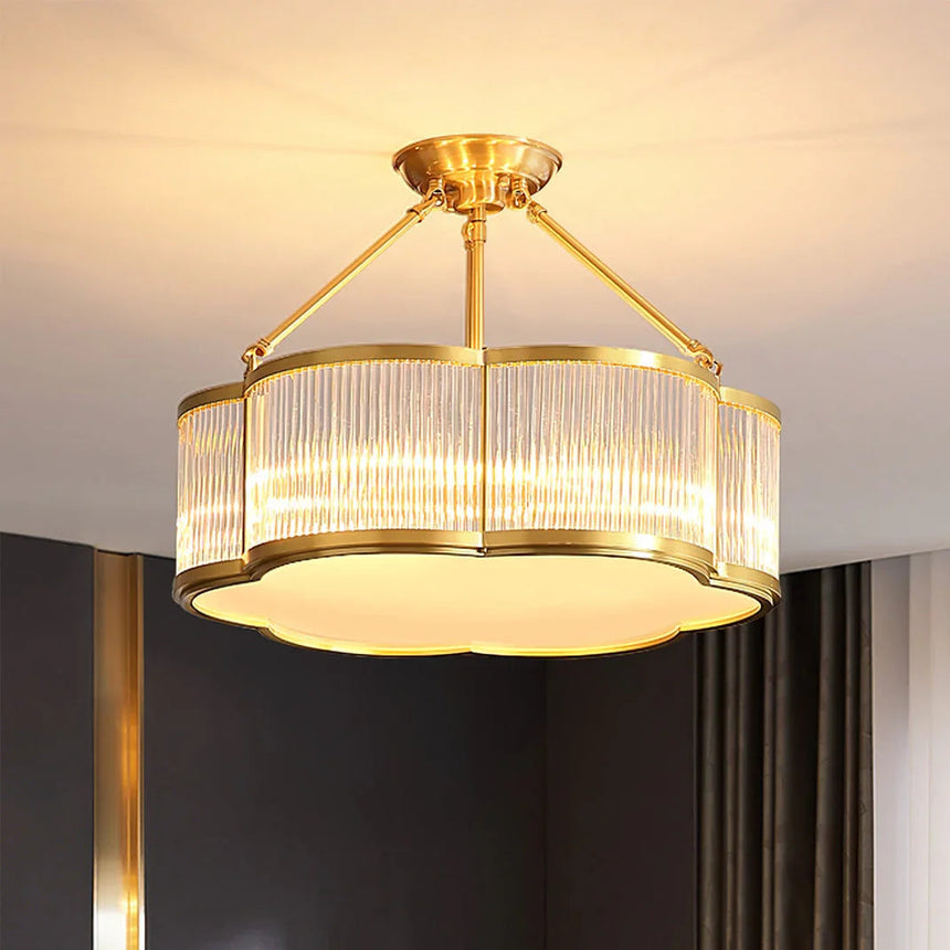 The fluted drum lit in a dark room with heavy curtains to one side