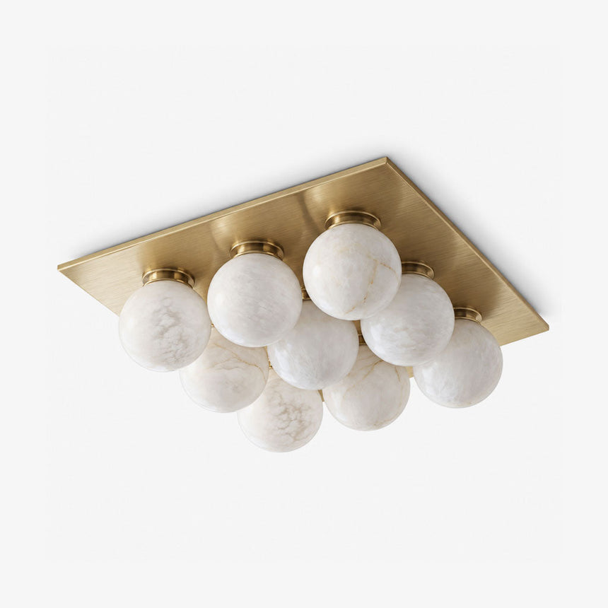 Luxury flush mount ceiling lights with nine alabaster balls on a brass square canopy