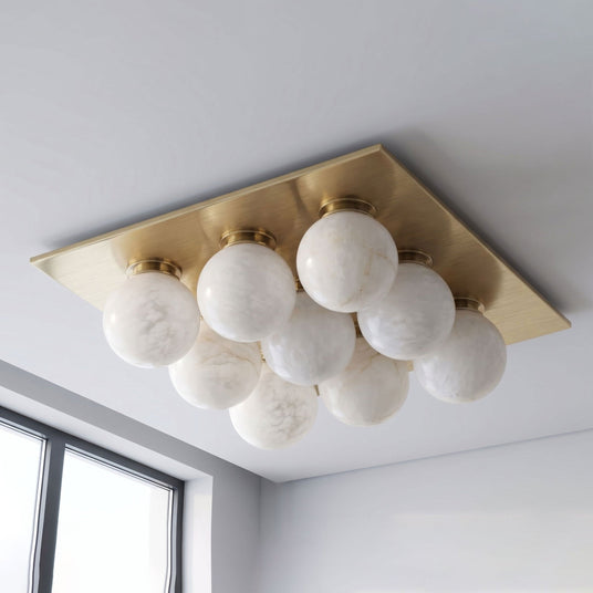 Brushed brass version of the nine ball alabaster ceiling light seen from below