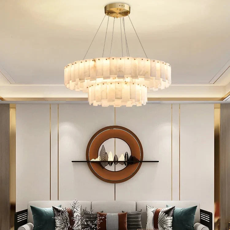 Marble ring chandelier in a living room beside a round mirror