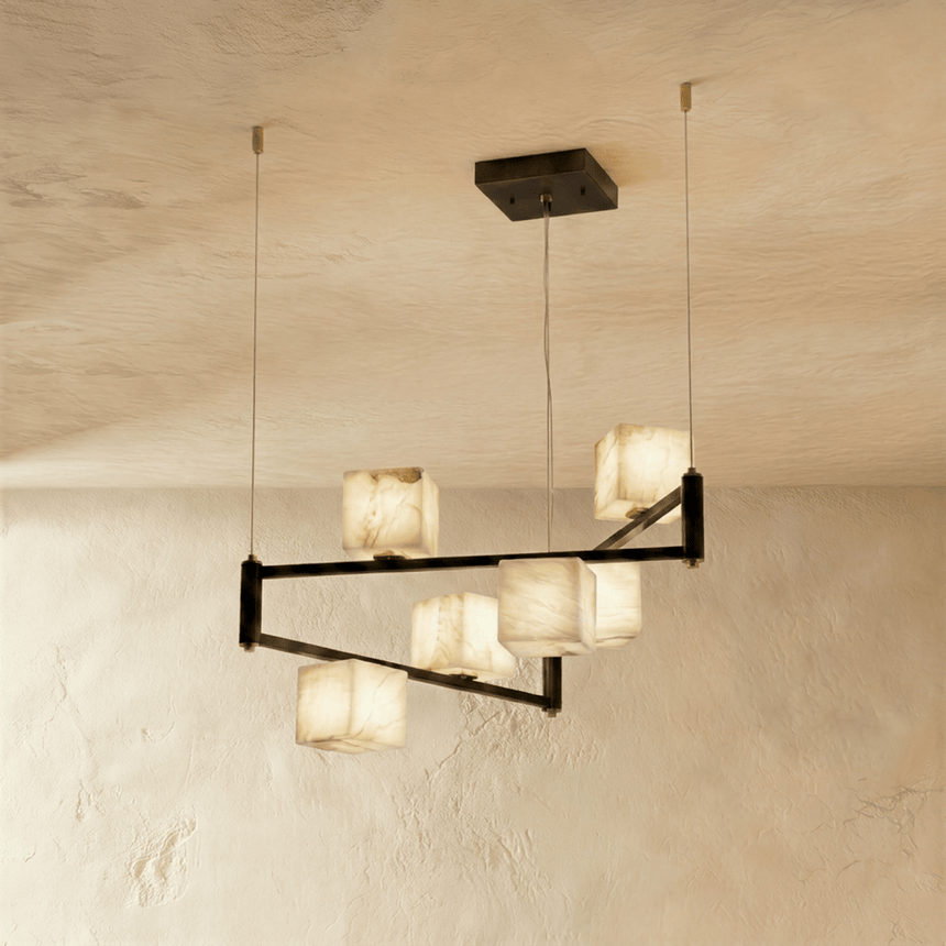 Alabaster cubes lit on two levels of black arms, staggered rather than in a row