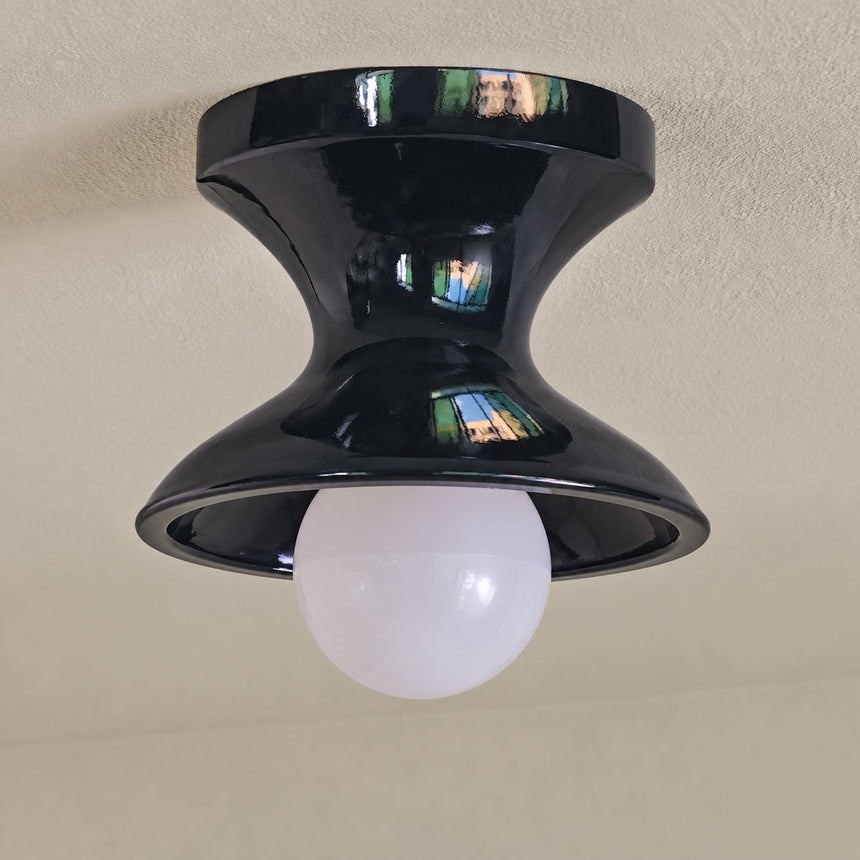 Close view of the navy spool ceiling light seen from below
