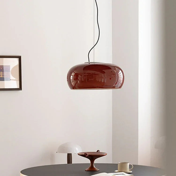 Red glass dome above a dark round table
