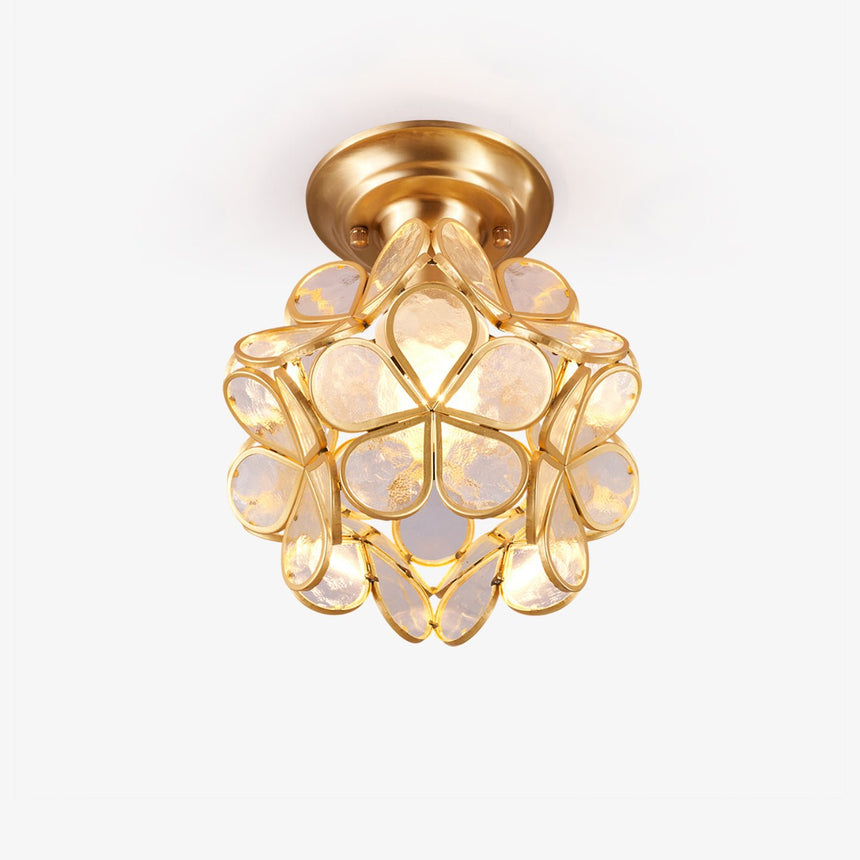 Mini ceiling light with clear glass petals set in a gold plated frame