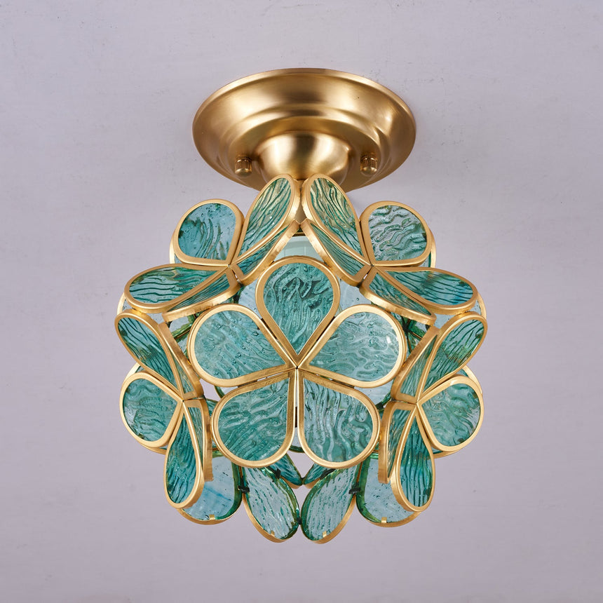 Green glass petal ceiling light seen from below