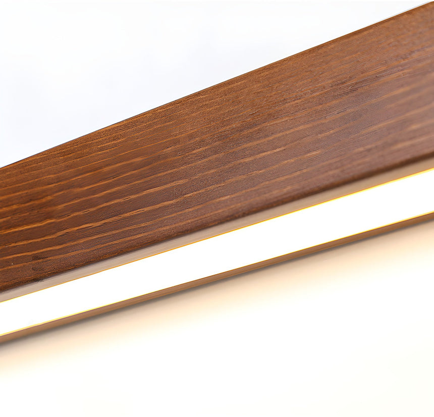 Close view of the walnut grain along the body of the lit bar