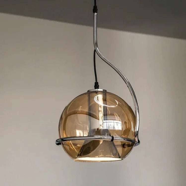 The globe lit from inside beside a tall window in a pale room