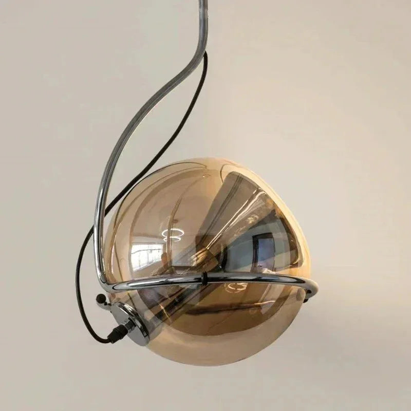 Close view of the half mirrored globe turned inside its metal ring