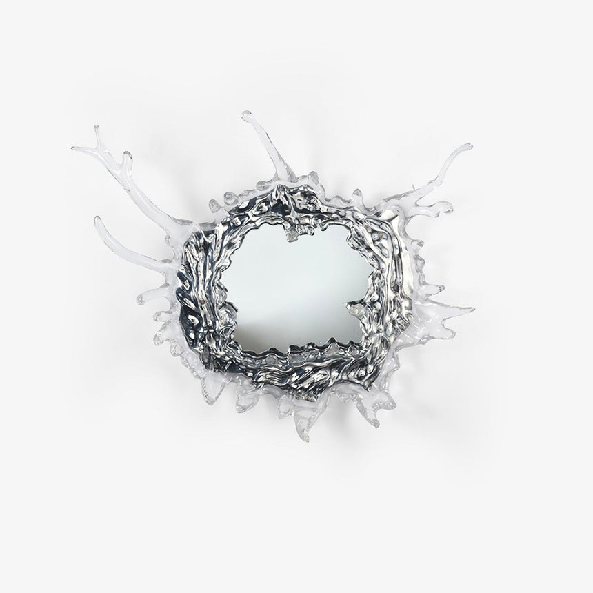 Round mirror wall light framed by a sculpted splash of clear drops in a chrome finish