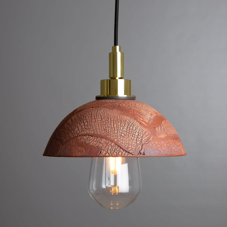 Ceramic dome pendant light with textured crackled finish