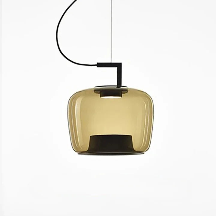 Single amber glass shade on a black arm against white