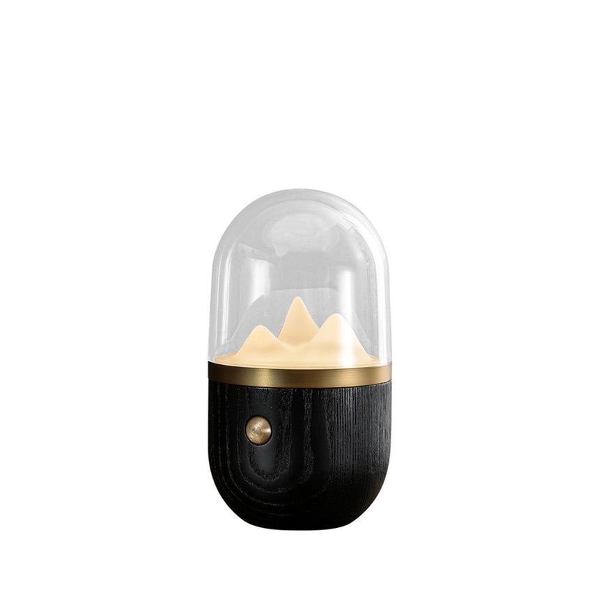 Nursery table lamp with a black wood base, plain background