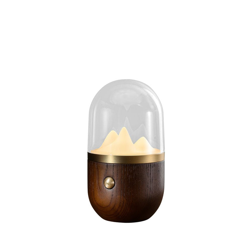 Nursery table lamp with a walnut wood base, plain background