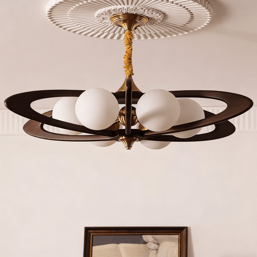 The globes unlit, showing the wood rings and the brass stem clearly