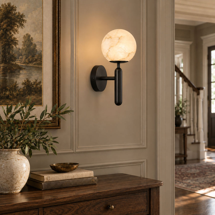 The black version lit on a paneled wall above a wood console