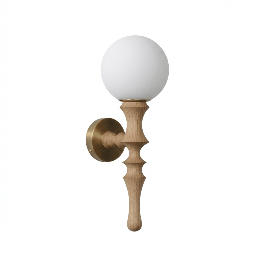 The pale wood stem seen from the front, the white orb sitting on its top