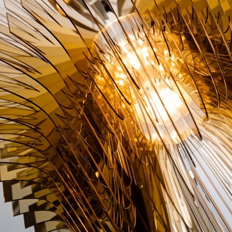 The amber acrylic layers lit close, each blade catching light along its edge