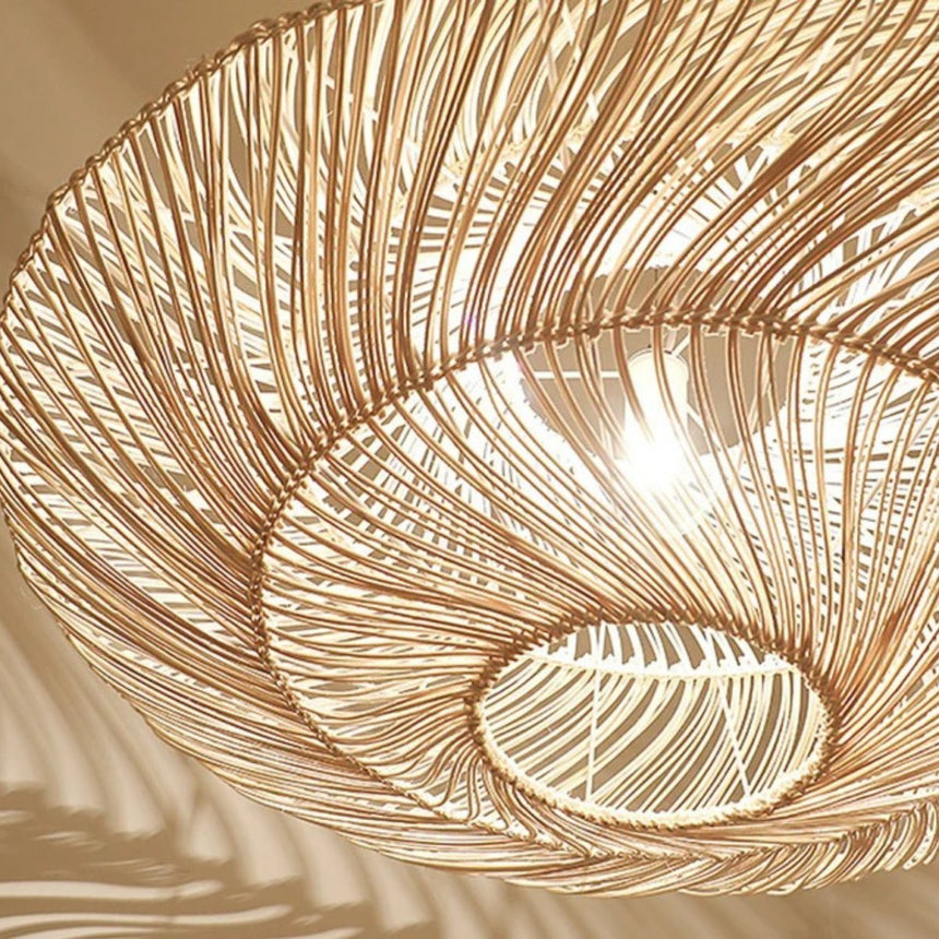 The woven strands seen from below, lit so the spiral of the weave shows