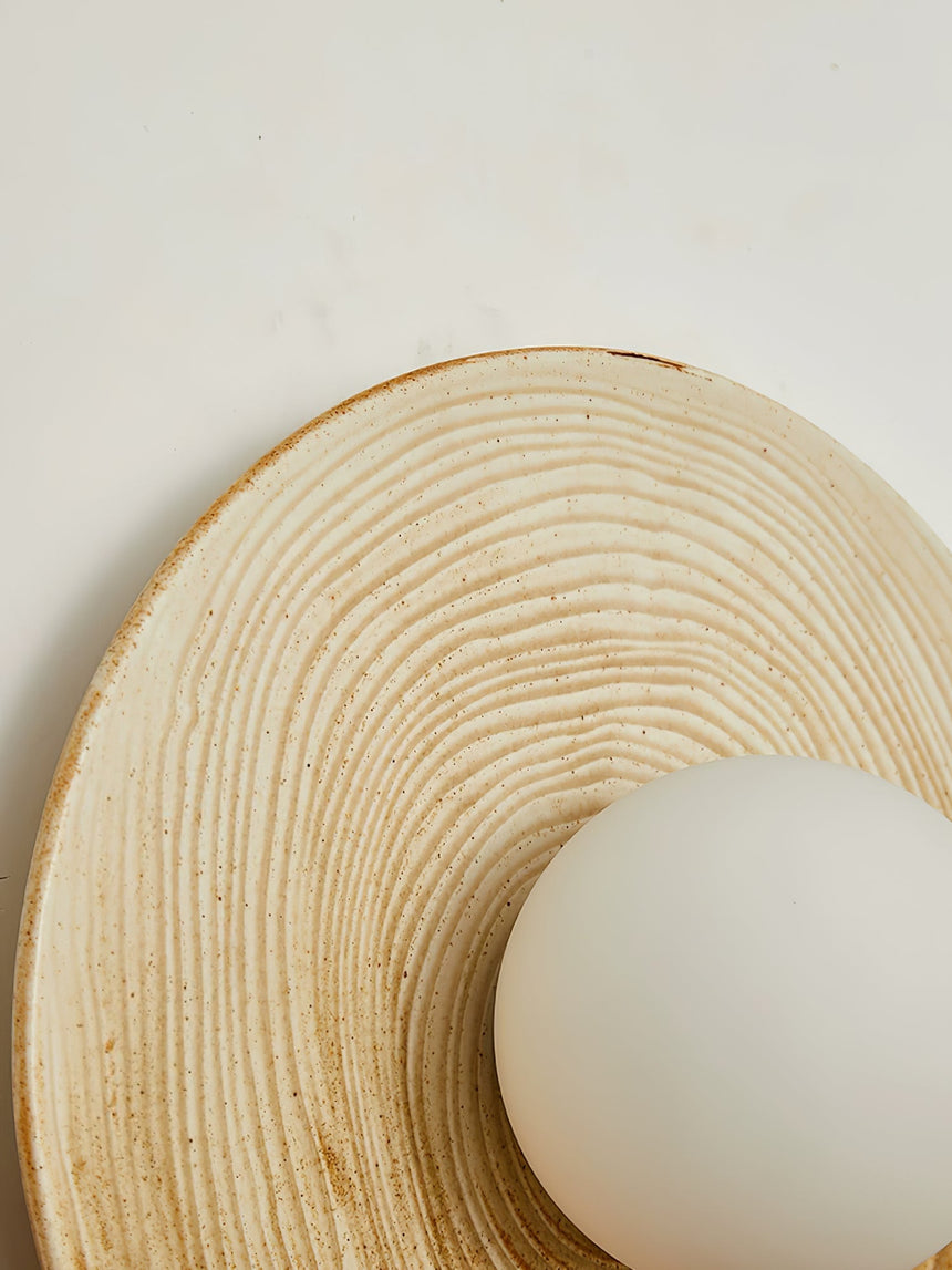 Close view of the concentric rings in the glaze beside the opal globe