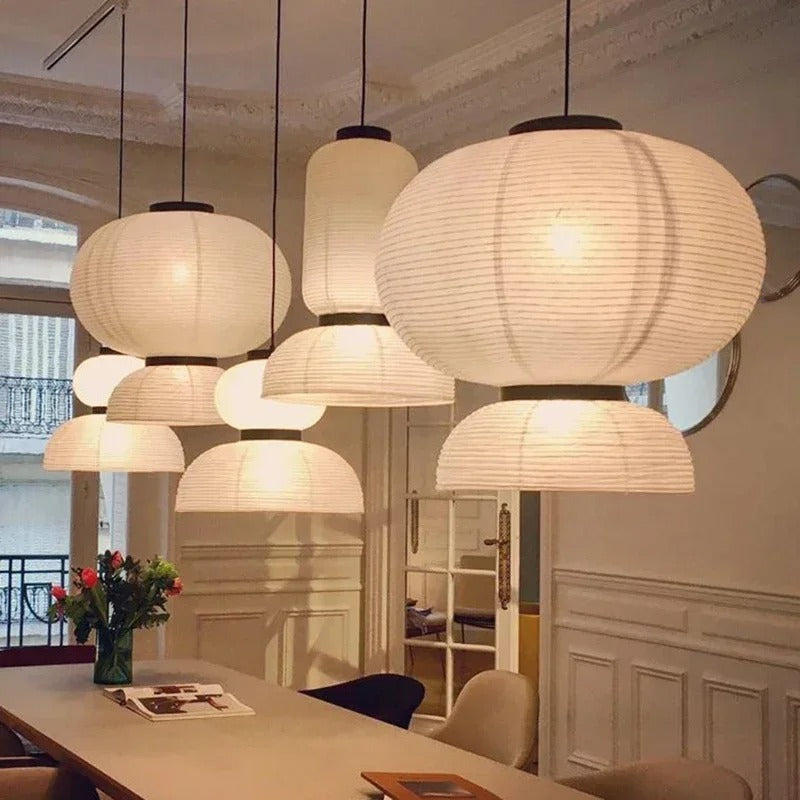 Four rice paper lanterns at different sizes hung as a cluster