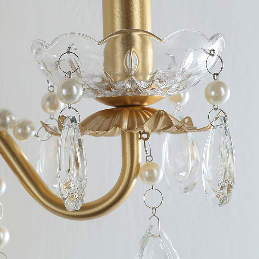 Close view of a crystal bobeche with pearls and hanging crystal drops
